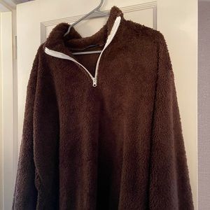 Brown fuzzy pull over.